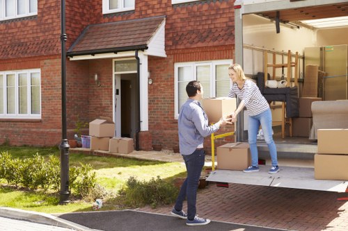 Removal team carefully handling furniture during a safe move