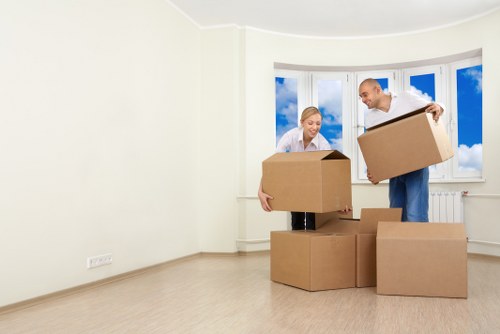 Removal van and moving boxes outside a Kingston residential property