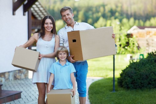 Local moving team handling boxes and furniture in Kingston