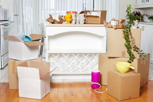 Local office removals team handling boxes and desks in Kingston