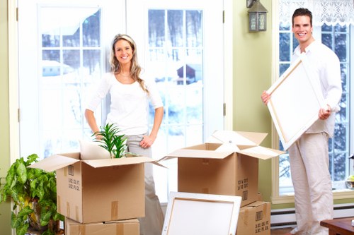 Packed office boxes and furniture ready for commercial moves in Kingston